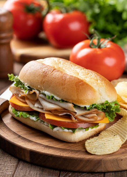 istock Turkey sandwich with lettuce cheese and tomato 1396659225