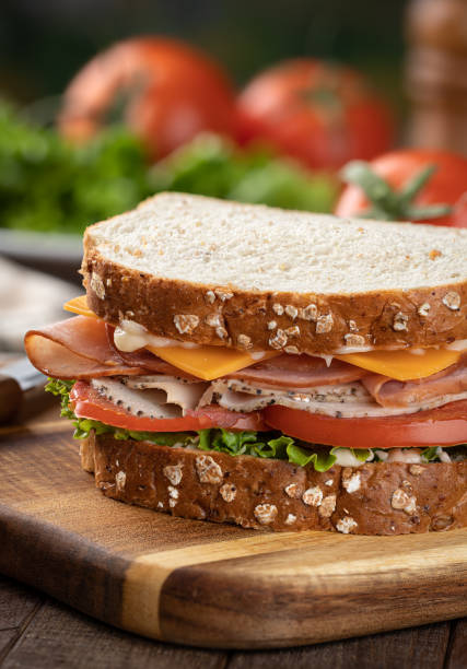 istock Turkey and ham sandwich on whole grain bread 1396659237
