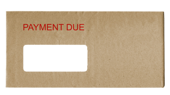 envelope with payment due in red letters
