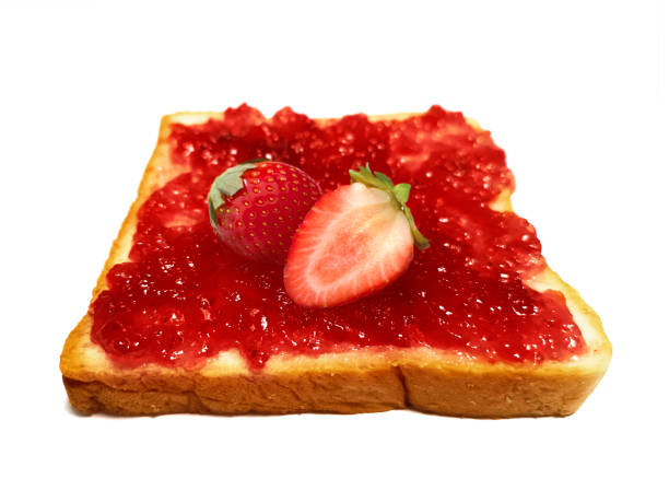 Fresh strawberry on slice of bread with strawberry jam isolated on white
