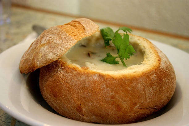 Seafood chowder in a bread bowl stock photo