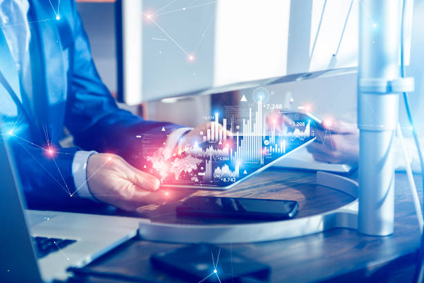 Teamwork with massive data behind a futuristic interface Teamwork with massive data. Businessman uses Digital tablet with behind a futuristic interface. ai business stock pictures, royalty-free photos & images