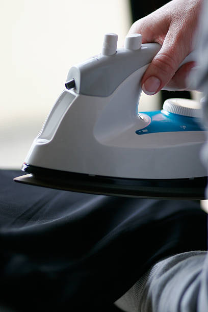 Ironing by hand stock photo