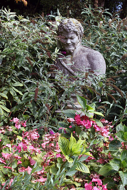 istock Garden statue amongst flowers 139666904
