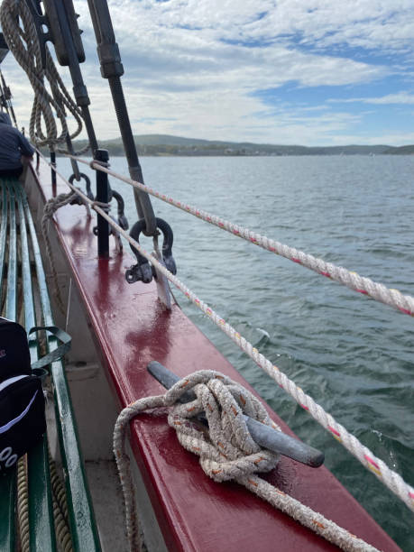 istock View off side of sailing ship with ropes and railing. 1396670062