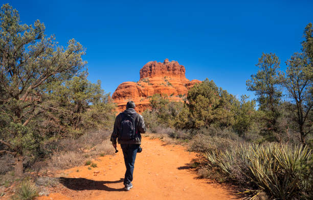 istock Man on spring hiking trip in red mountains. 1396670122