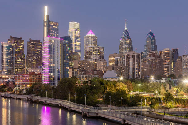 istock Philadelphia Downtown skyline at Night with the Schuylkill river. Beautiful Sunset Light. Schuylkill River Trail in Background. City skyline glows under the beautiful sunset light. Cityscape. PA, USA. 1396670509