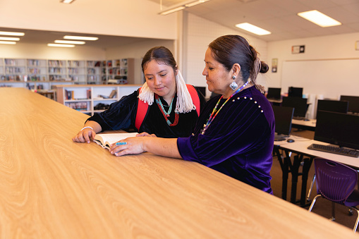 Portrait of a Navajo high school teacher and a female student. Image taken on the Navajo Reservation, Utah, USA.