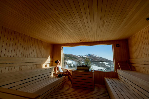 istock Young woman relaxing in the sauna 1396671215