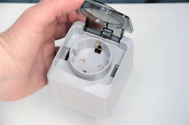 istock socket for conducting electricity and connecting devices in the hand 1396672714
