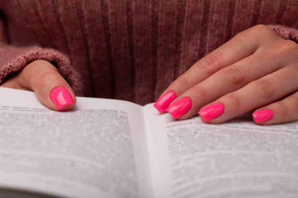 istock Woman hands on a book 1396672922