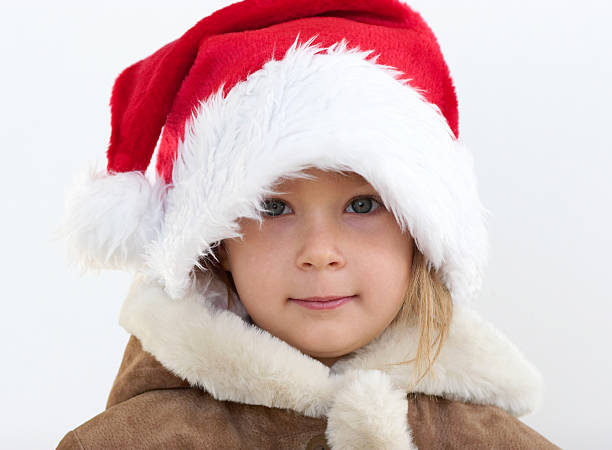 istock Little pretty girl with santa's hat 139667384