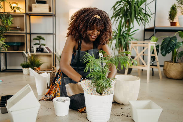 istock Smiling woman with plants 1396676952