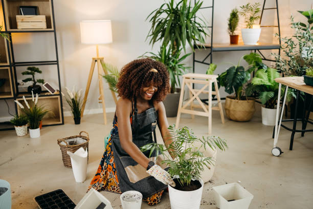 istock Smiling woman with plants 1396676979