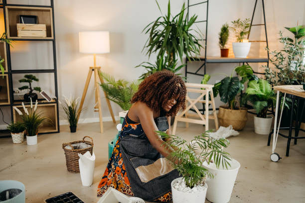 istock Smiling woman with plants 1396677008
