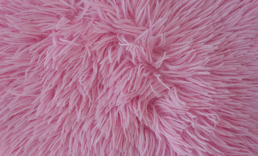 Pink artificial fur background. Copy space, space for text.