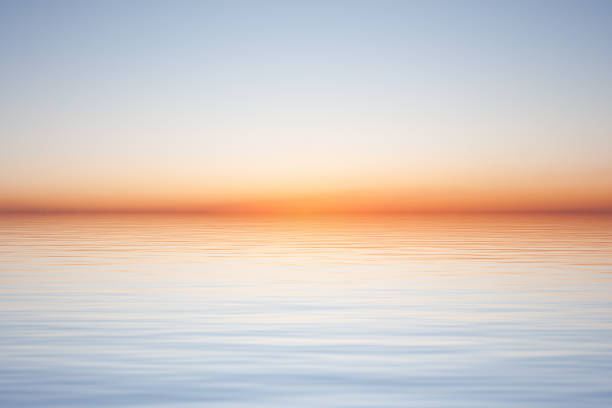 istock Clear morning blue sky over water surface with waves 1396678780