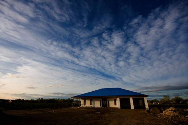 Modern residential property against blue sky background.