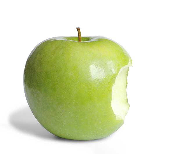A green apple with a bite taken out of it Green apple apple with bite out stock pictures, royalty-free photos & images