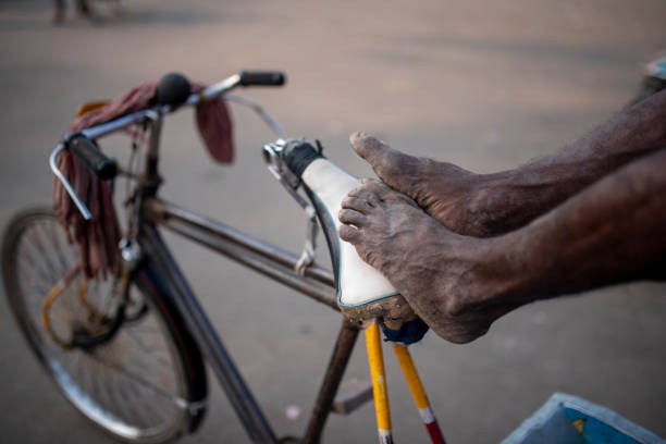 istock Hard working rickshaw Labour resting on his rickshaw closeup stock photo 1396680607