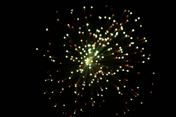 istock Low Angle View Of Firework Display bokeh At Night spreading light 1396680679