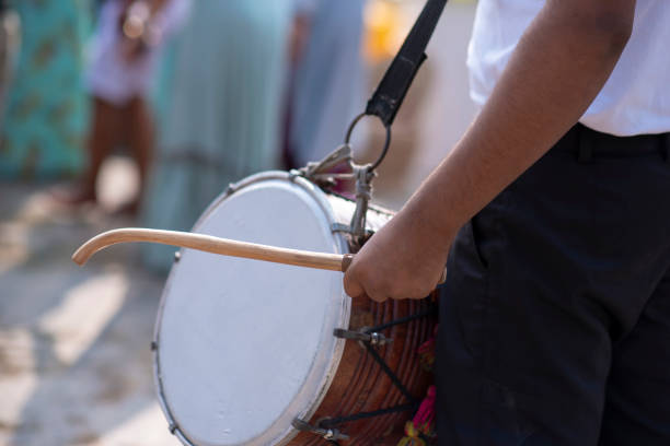 istock Man Playing Dhol with Stick Stock Photo 1396680868