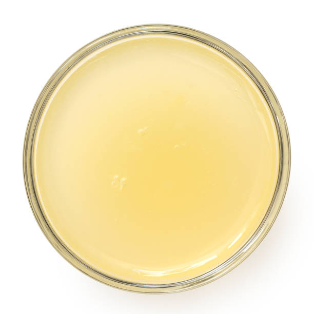 istock Freshly squeezed lemon juice in a glass bowl from above. 1396680986