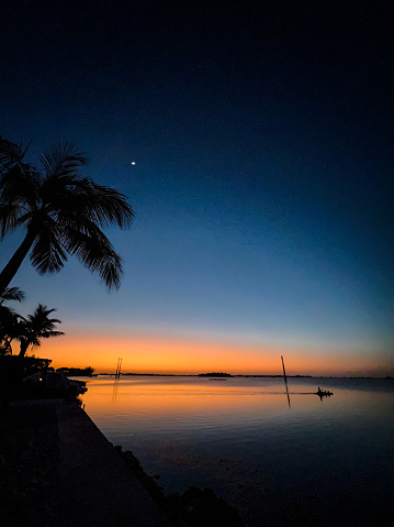 Key West Florida woman kayaking at sunset
