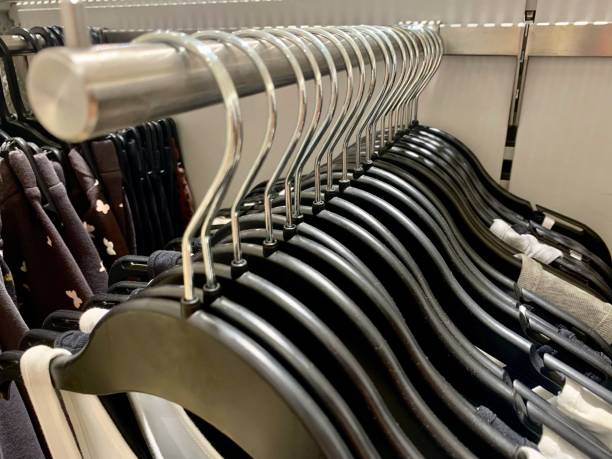istock Clothes hangers in a row 1396682454
