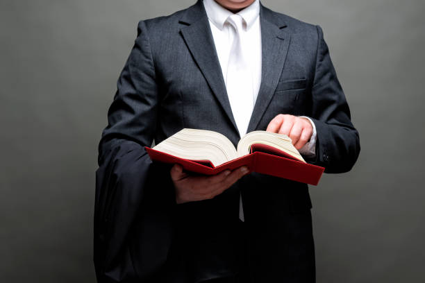 istock german lawyer with a robe and a book 1396683882