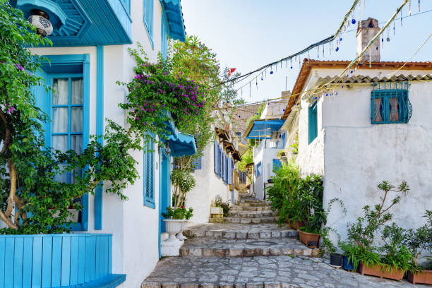 Awesome view of a cozy narrow street in Marmaris, Turkey Awesome view of a cozy narrow street in Marmaris, Turkey. Scenic white houses of the old town. The port city is a popular tourist destination in the Turkish Riviera. marmaris stock pictures, royalty-free photos & images