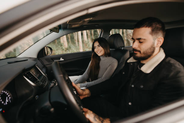 istock couple traveling by car 1396686211
