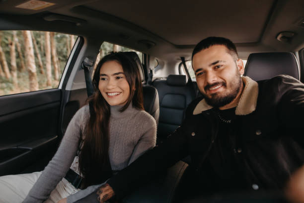 istock couple traveling by car 1396686212
