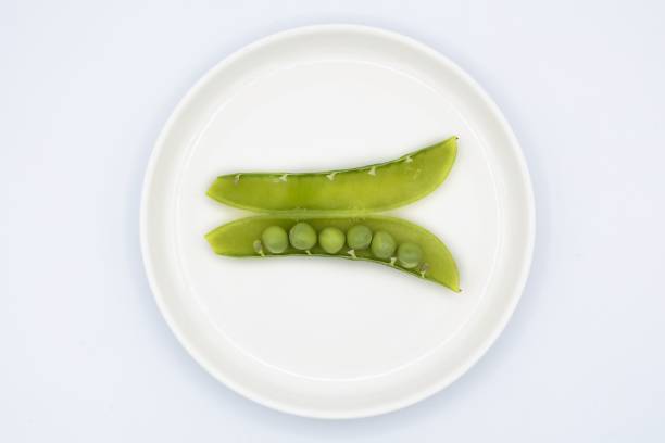 istock Fresh green peas with bright green 1396686300