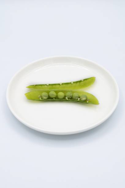 istock Fresh green peas with bright green 1396686312