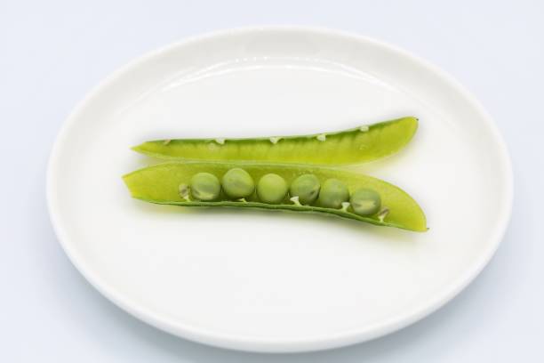 istock Fresh green peas with bright green 1396686320