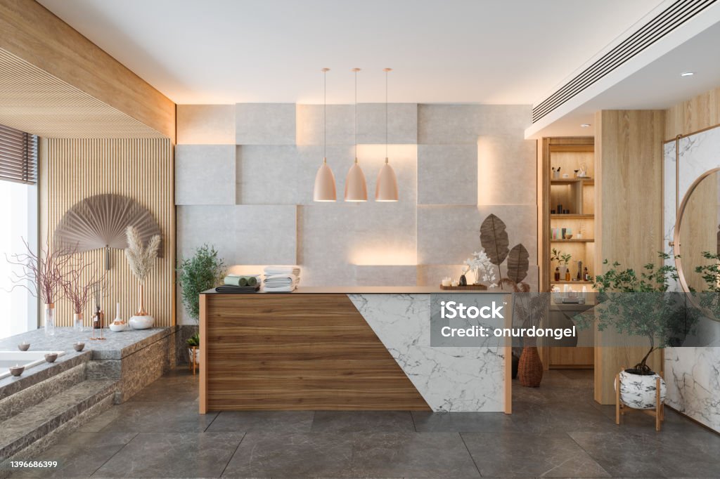 Reception Area Of Modern Spa With Reception Desk, Potted Plants, Decorative Objects And Marble Floor Spa Stock Photo