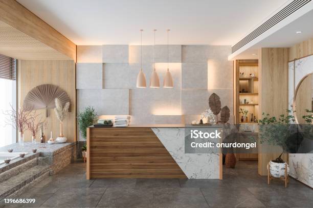 Reception Area Of Modern Spa With Reception Desk Potted Plants Decorative Objects And Marble Floor Stock Photo - Download Image Now