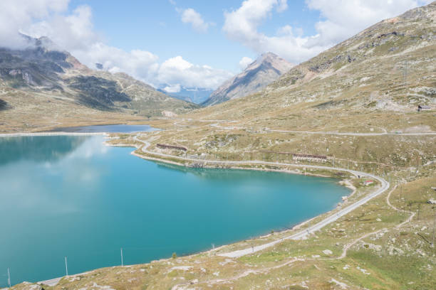 drone view of lago bianco lake on bernina pass, grisons, switzerland - white lake imagens e fotografias de stock