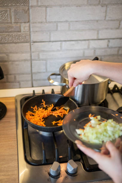 istock carrot and onion on frying pan 1396689321