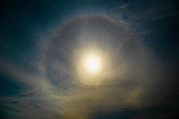 Atmospheric optical phenomena. 22 degree halo in summer sky