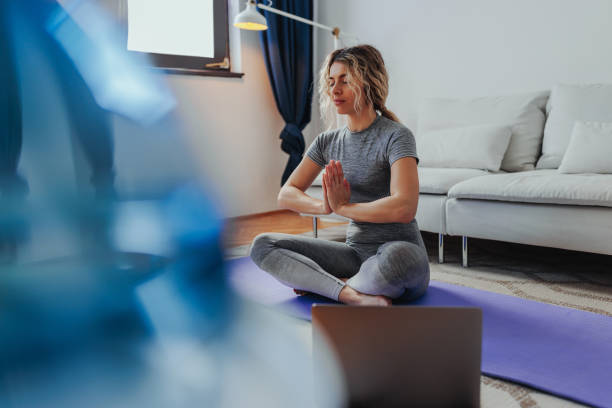 istock Young girl learning yoga at home 1396690523