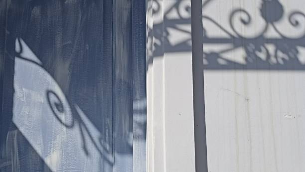 istock midday shadows on the building close up front view 1396692167