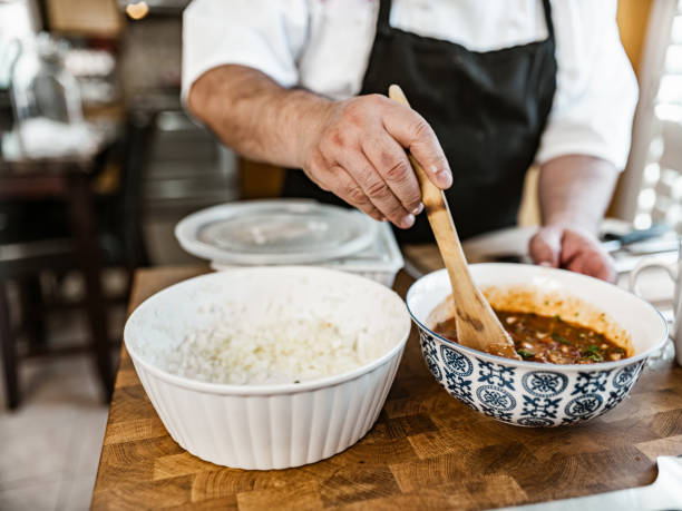 istock Mature Latin Chef preparing home made salsa 1396692415