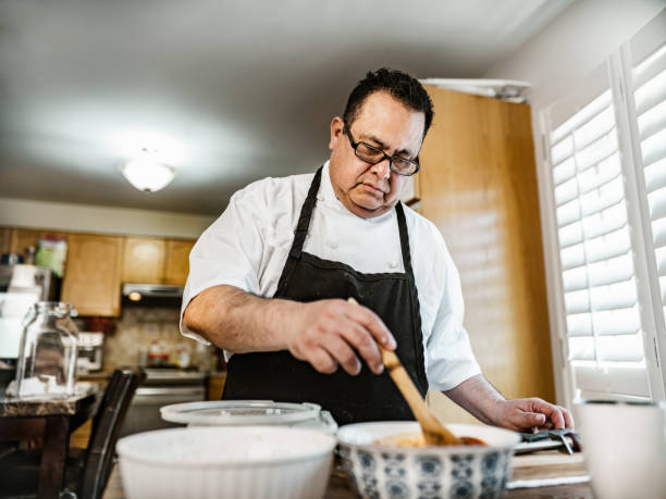 istock Mature Latin Chef preparing home made salsa 1396692432