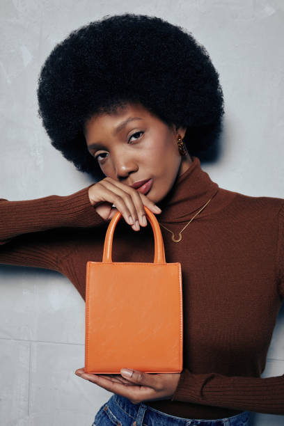 istock Fashion Model Showcasing Purse 1396693485