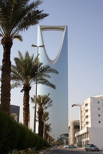 istock High building with palm trees and light blue sky 139669356