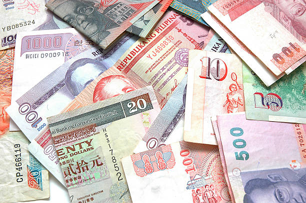istock Different types of paper world currency in a pile 139669382