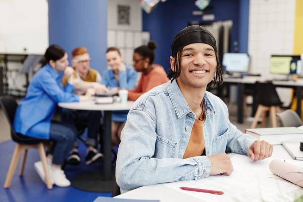 istock Smiling Young Man in College 1396696312