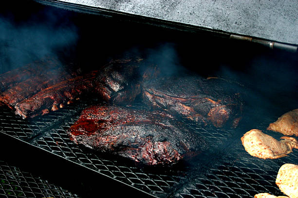 Smoked Meat Picture of a smoker at a BBQ contest with winning brisket brisket photos stock pictures, royalty-free photos & images